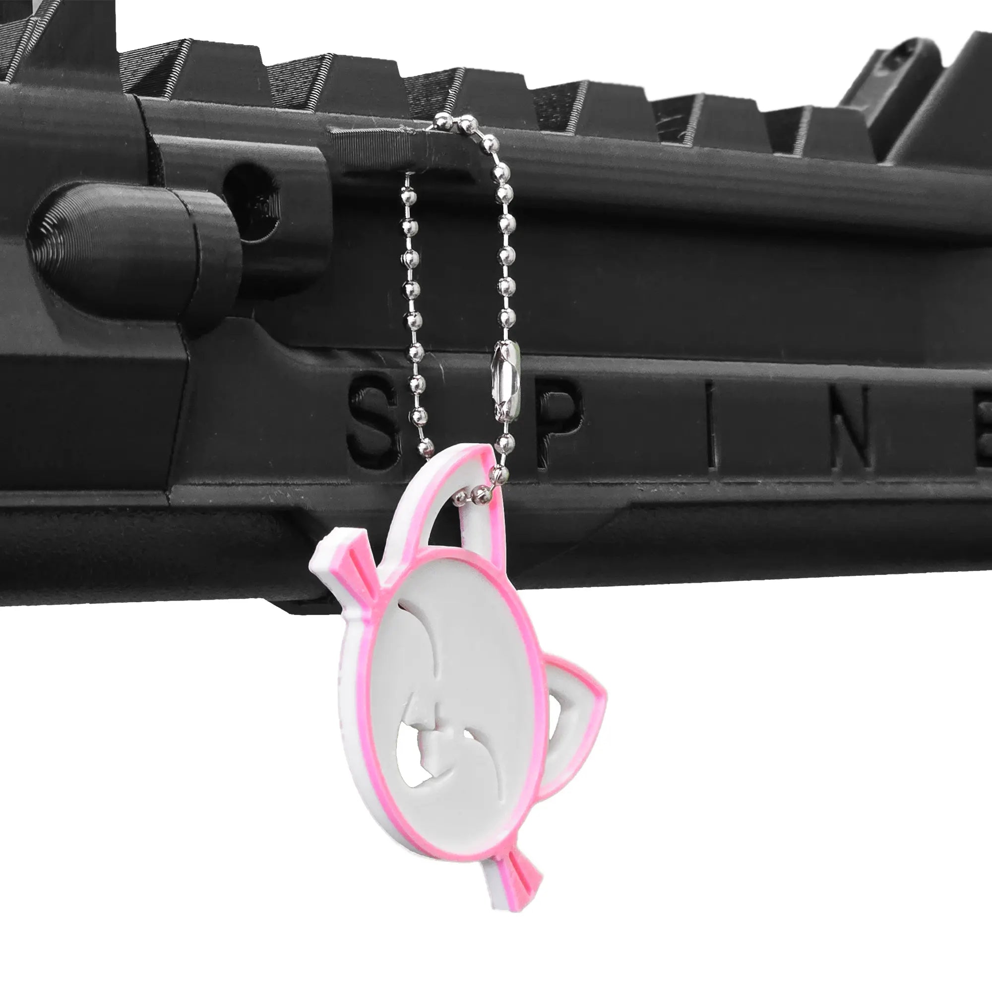 Cat smiling keychain hanging from a SPINE VR Gun Stock using a ball chain 